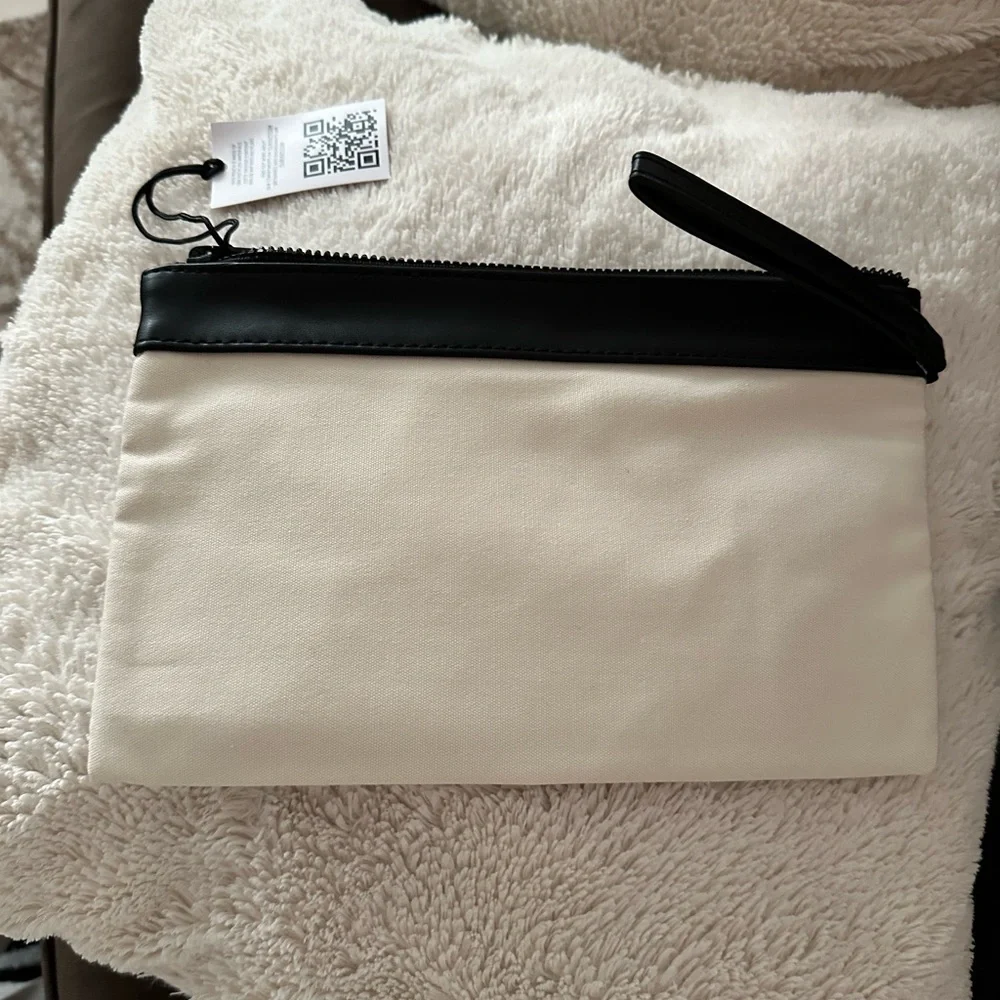 Black and Cream woman YSL beaute  Bag